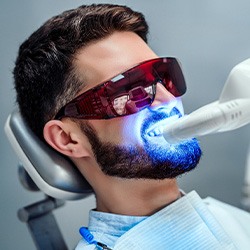 A man getting his teeth whitened