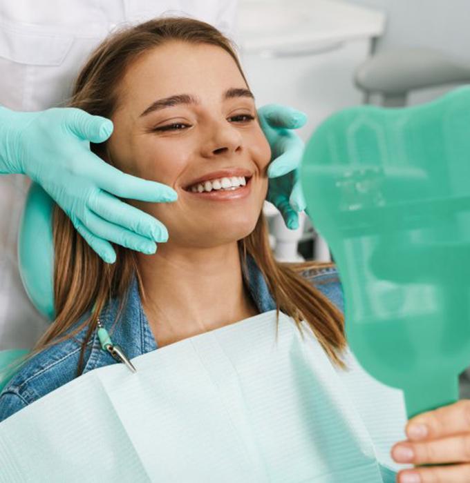 A woman enjoying her new dental crowns