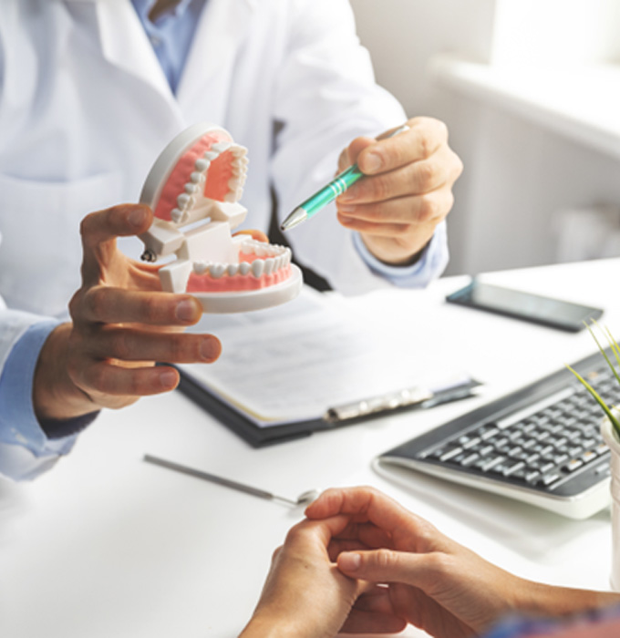 a patient speaking with their dentist