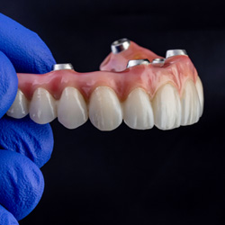 a close-up of implant dentures
