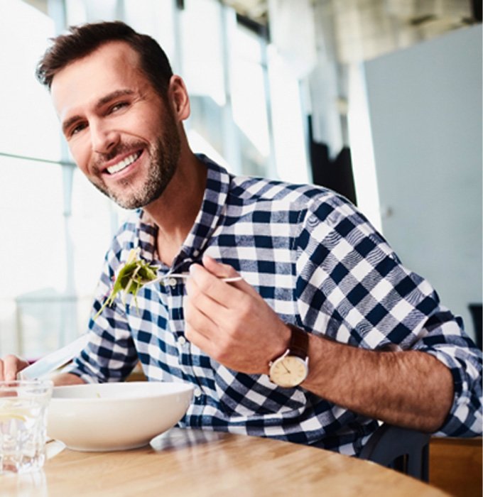 Man eating with All-On-4 in Chelsea   