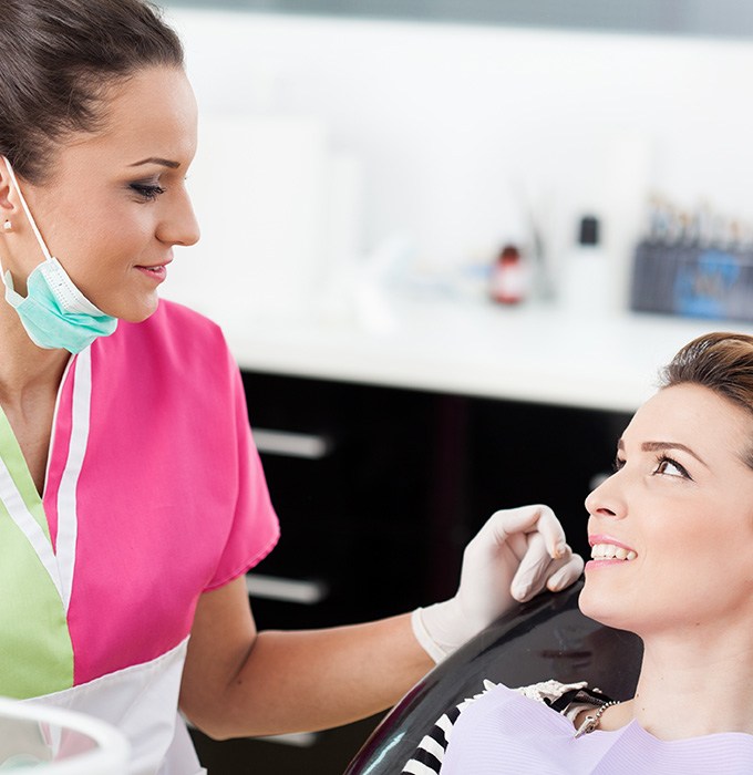 Woman talking to a dentist