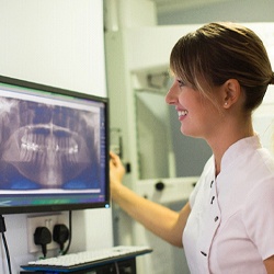 dentist looking at patient X-rays