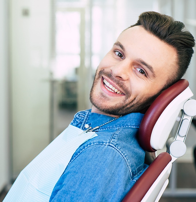 Man smiling after dental checkup and teeth cleaning