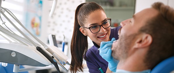 Patient receiving preventive dentistry exam