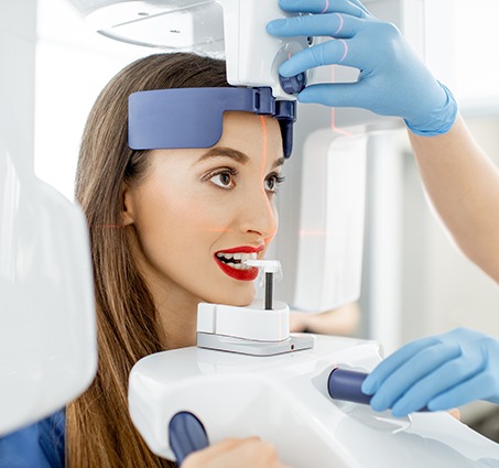 Woman receiving 3 D C T dental x-ray scan