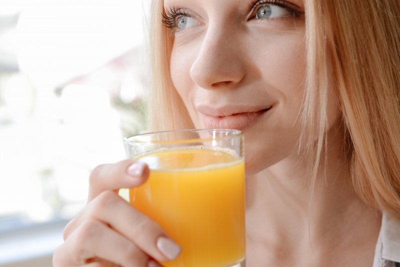 young woman drinking fresh juice